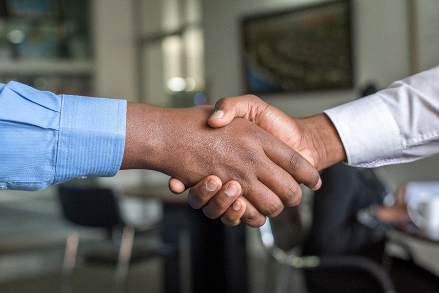 A handshake with a well-written technical spec as a start of successful software development partnership 